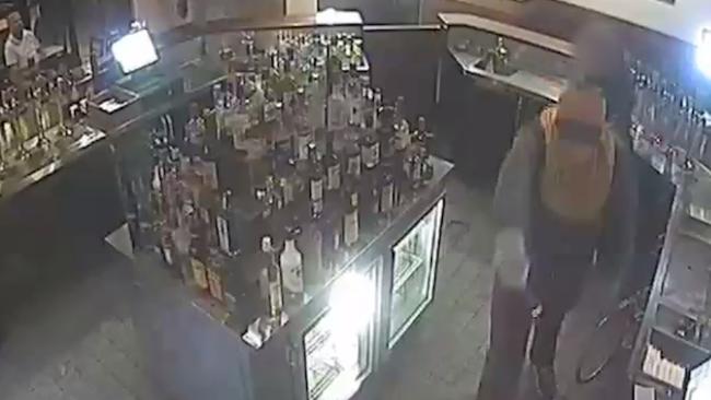 Police have released CCTV of the moment an inner-city hotel was robbed at knifepoint last month.