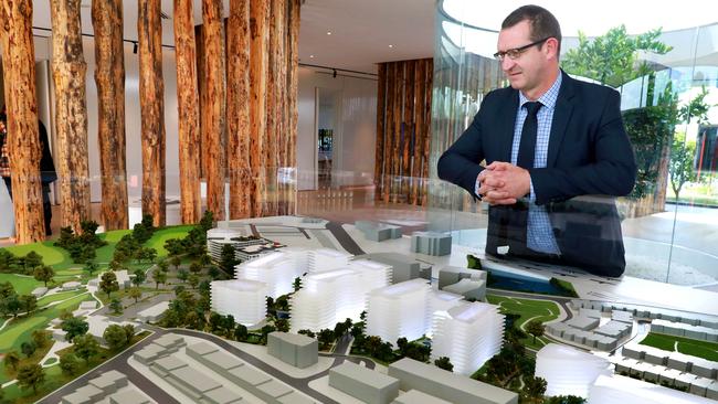 Sales and Marketing Operations Manager Paul Wainwright with a 3D model of the development of the The Orchards. Pic: AAP Image/Angelo Velardo