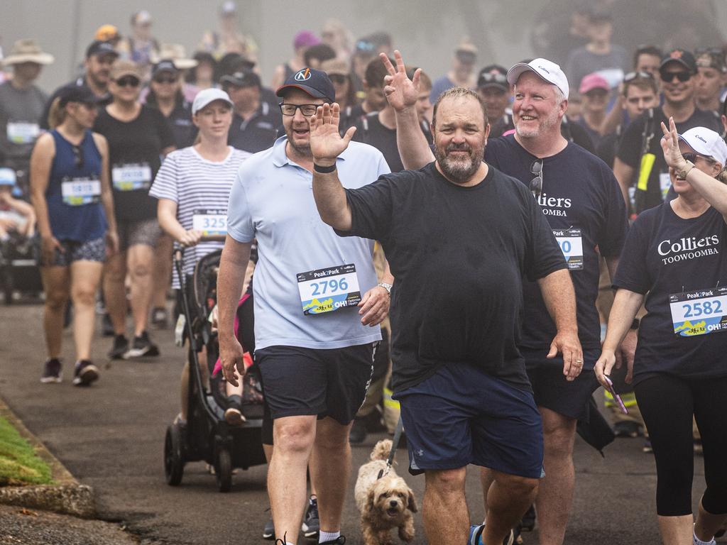 Barry O'Sullivan (front, centre) waves while walking with the Colliers Toowoomba team at Peak2Park, Sunday, March 3, 2024. Picture: Kevin Farmer