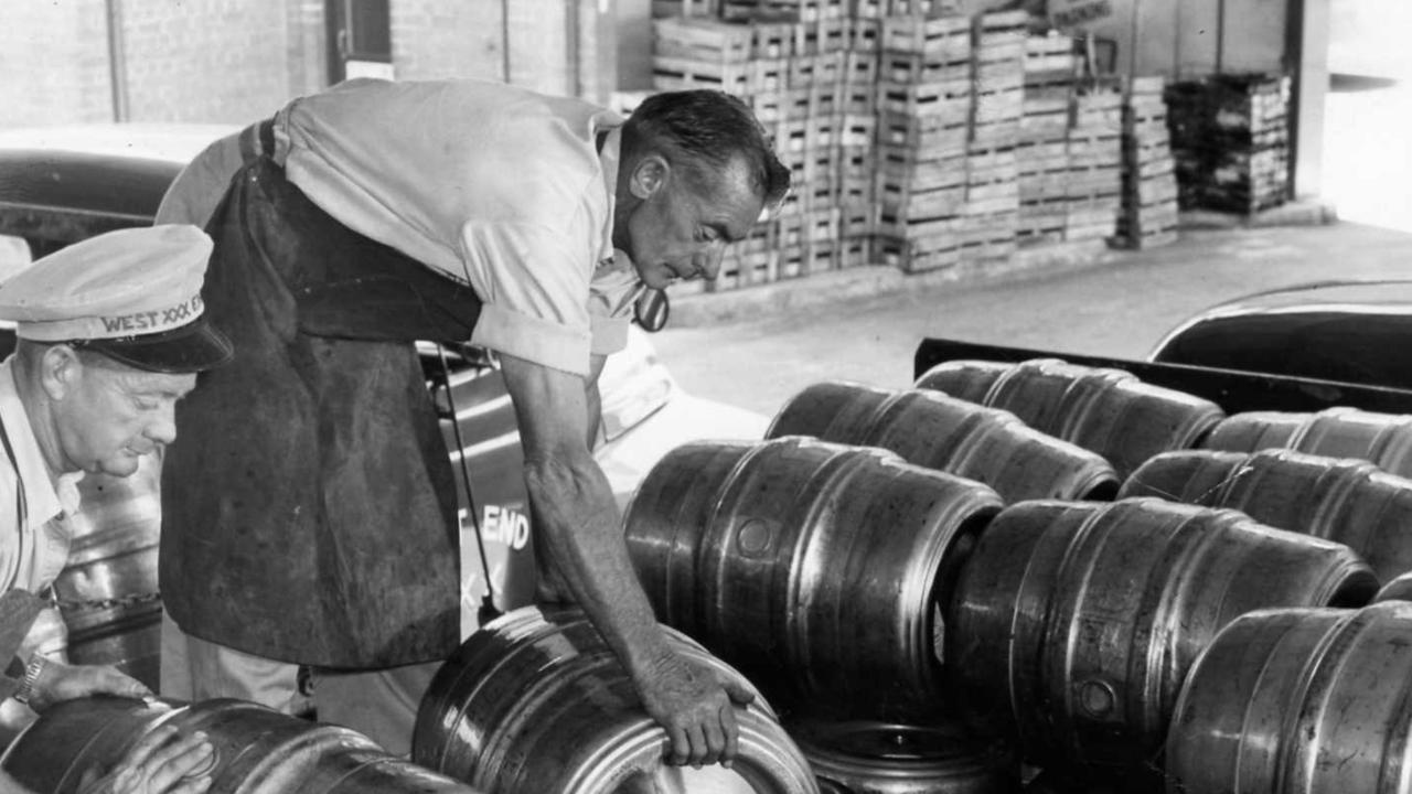 Workers loading truck with steel beer kegs at the West End Brewery, Adelaide. Filed 16 Mar 1959.