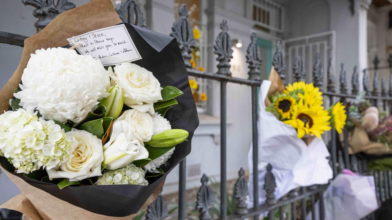 Floral tributes left to the two men, outside Baird’s Paddington home. Picture: Monique Harmer