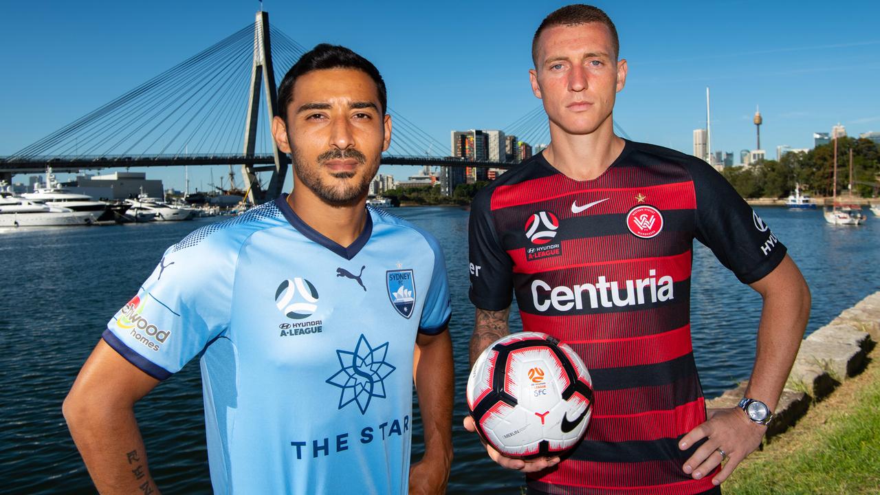 Wanderers striker Mitch Duke (R) poses with Sydney FC star Reza Ghoochannejhad.