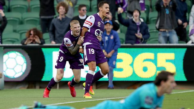 Perth’s Chris Ikonomidis, right, is congratulated by Andy Keogh after scoring a late winner for Glory against Central Coast at nib Stadium. Picture: AAP