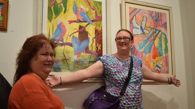 Roxanne MacGregor with artist Stephanie Robson displaying their work.