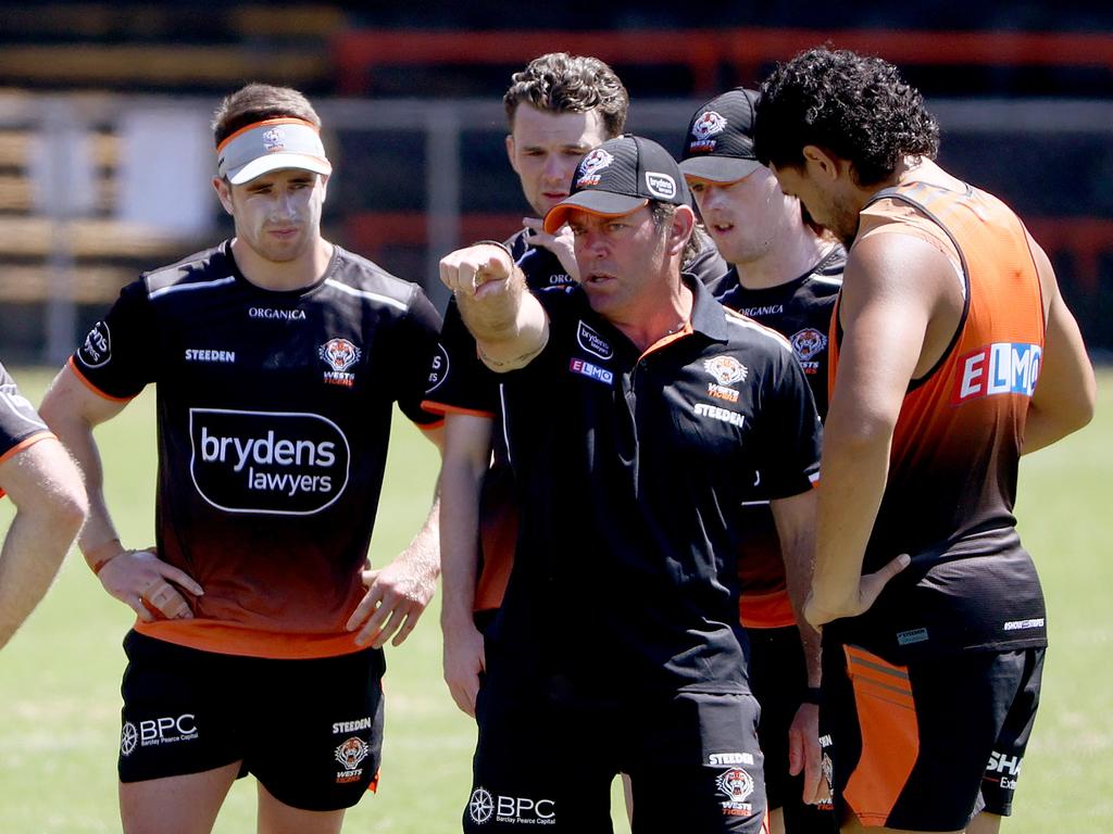 Assistant coach Brett Kimmorley (2nd from R) gives directions at training. Picture: Toby Zerna