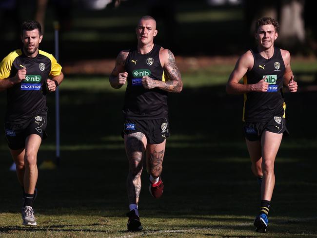 Richmond’s Dustin Martin, Trent Cotchin and Sam Banks during a running session in December. Picture: Michael Klein