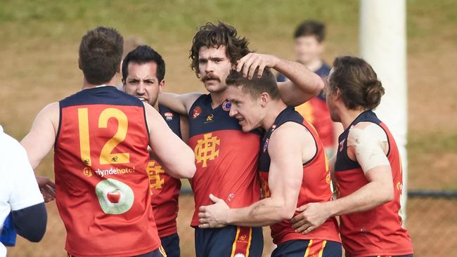 Hectorville's Jake Mazzone (centre) celebrates a goal with Hounds teammates. Picture: Matt Loxton