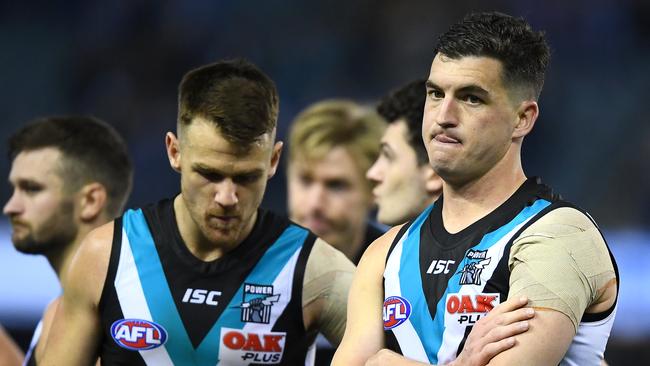 Robbie Gray and Tom Rockliff react after the horror loss. Picture: Quinn Rooney/Getty Images