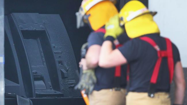 Emergency Services enter the burnt out bank branch. Picture: Michael Dodge/Getty