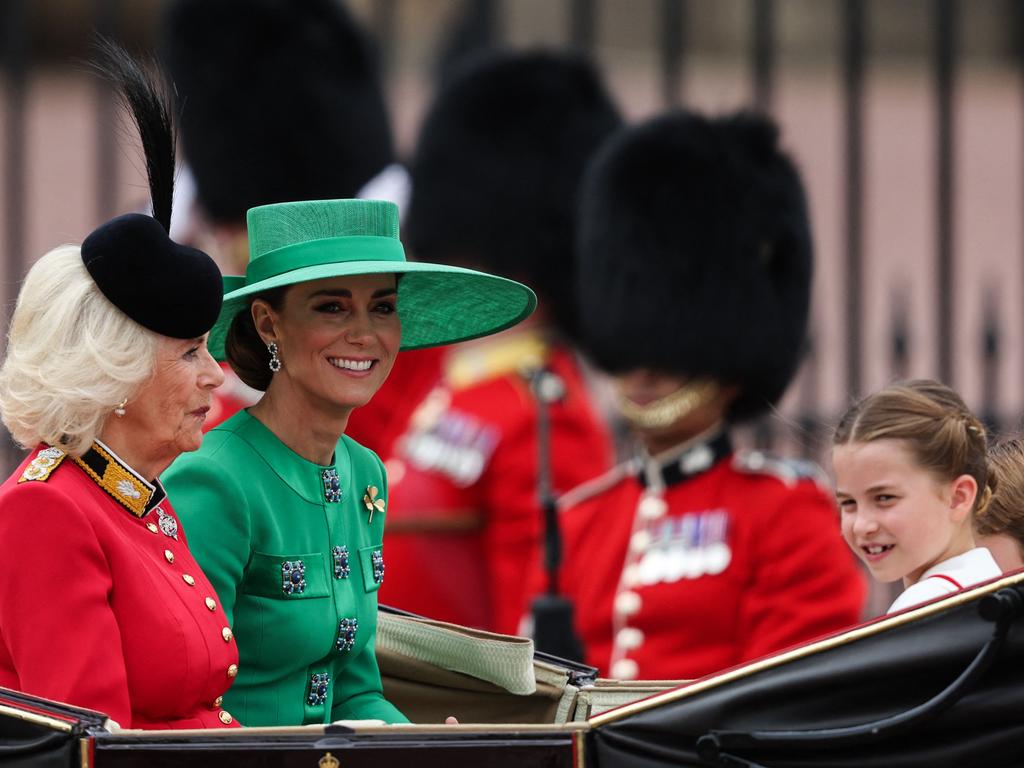 Britain's Queen Camilla, Britain's Catherine, Princess of Wales and Britain's Princess Charlotte of Wales (R) smile as they leave Buckingham Palace in a horse-drawn carriage being taken to Horse Guards Parade for the King's Birthday Parade. Picture: Adrian Dennis/AFP