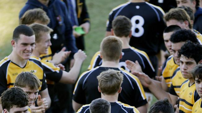 ISA2 cheer ISA1 onto the field. ISA1 v (black and gold) GPS1 (blue stripes). U18 NSW Boys Rugby Schools Selection trials. Picture: John Appleyard