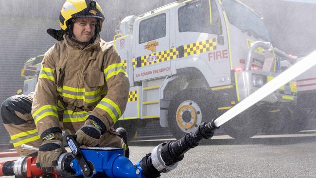 December 22, 2024: Sam Hakendorf  - Volunteers Burnside CFS with one of the trucks the CFS is rolling out for Christmas at Beth CFS Headquarters. Picture: Kelly Barnes