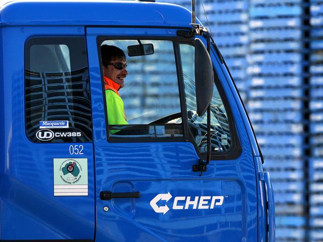 A worker sits inside a truck at Brambles Ltd.'s CHEP pallet service center outside Melbourne, Australia, on Monday, Aug. 17, 2009. Brambles Ltd., the world's biggest supplier of pallets used to move and store goods in factories, will announce full-year earnings on Aug. 20, 2009. Photographer: Luis Enrique Ascui/Bloomberg