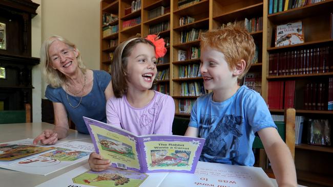 Faye Berryman, of Fitzroy Community School in Melbourne, with students Esther Howden, 6, and Cooper Gillies, 7. Picture: David Geraghty.