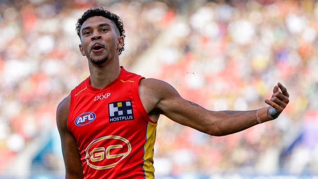 GOLD COAST, AUSTRALIA - MARCH 09: Malcolm Rosas of the Suns celebrates a goal during the 2024 AFL Opening Round match between the Gold Coast SUNS and the Richmond Tigers at People First Stadium on March 09, 2024 in Gold Coast, Australia. (Photo by Russell Freeman/AFL Photos via Getty Images)