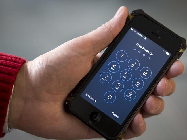 An iPhone is seen in Washington, Wednesday, Feb. 17, 2016. The San Bernardino County-owned iPhone at the center of an unfolding high-profile legal battle between Apple Inc. and the U.S. government lacked a device management feature bought by the county that, if installed, would have allowed investigators easy and immediate access. (AP Photo/Carolyn Kaster)