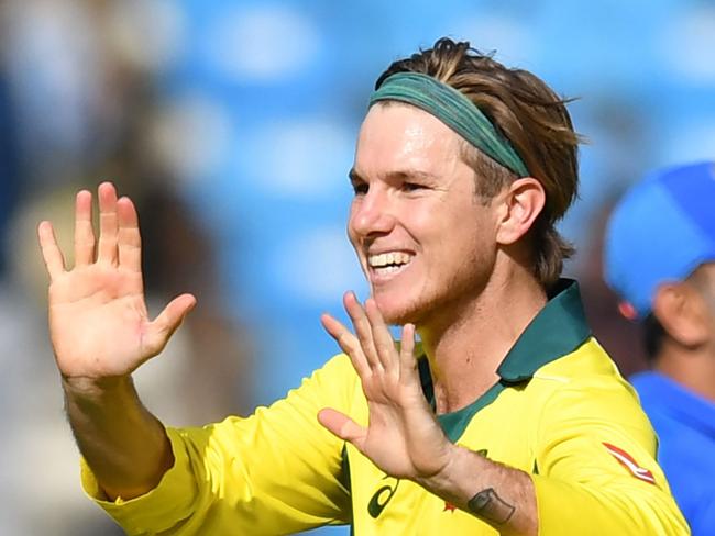 Australian cricketer Adam Zampa (2R) celebrates with captain Aaron Finch after taking the wicket of Indian batsman Mahendra Singh Dhoni during the second one-day international (ODI) cricket match between India and Australia at the Vidarbha Cricket Association Stadium in Nagpur on March 5, 2019. (Photo by PUNIT PARANJPE / AFP) / ----IMAGE RESTRICTED TO EDITORIAL USE - STRICTLY NO COMMERCIAL USE-----