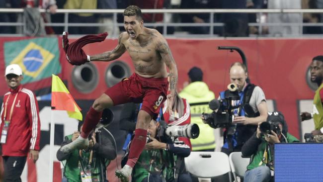 Liverpool’s Roberto Firmino celebrates after scoring in the 99th minute. Picture: AP Photo