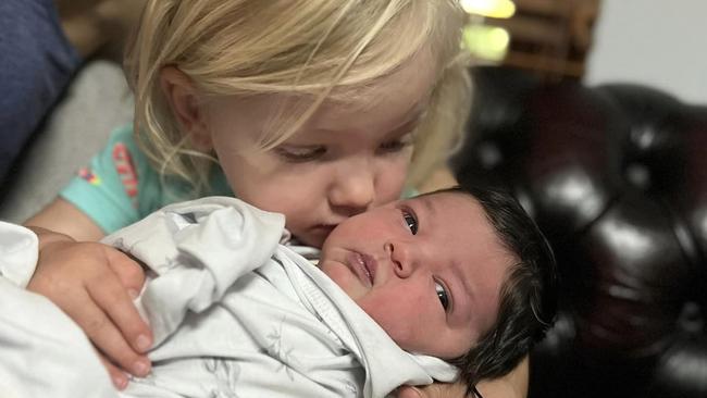 Newborn Mia Riley, pictured with her older sister Layla, died after two rottweilers attacked her. Picture: Supplied