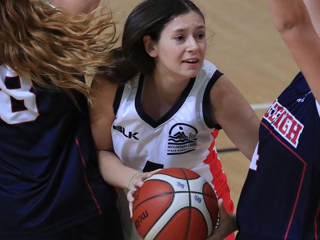 Zoe Byrne in action during the Molten CBSQ open competition game between Brisbane State High (blue) and Mountain Creek State High School (white) at Logan Metro Sports Sports Centre. Pics Adam Head