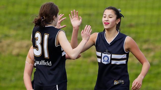 Siena Farrell of Caulfield Grammar celebrates a goal with teammates. Picture: Dylan Burns/AFL Photos via Getty Images