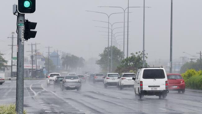 Showers and rain has finally arrived in Cairns and the Far North, affecting all coastal areas. Traffic drives along Mulgrave Road in the wet weather. Picture: Brendan Radke