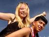 Schoolies out and about through Surfers Paradise despite many late nights partying. Sheyanne Christensen (17) gets a lift from Mitchell Brebner (17). Picture by Scott Fletcher