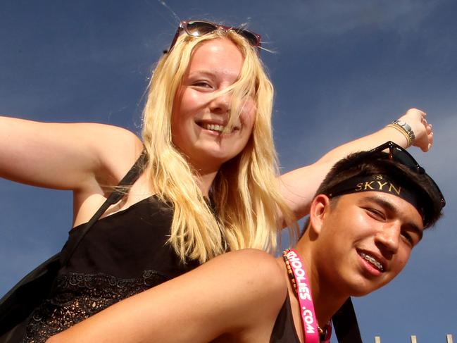 Schoolies out and about through Surfers Paradise despite many late nights partying. Sheyanne Christensen (17) gets a lift from Mitchell Brebner (17). Picture by Scott Fletcher