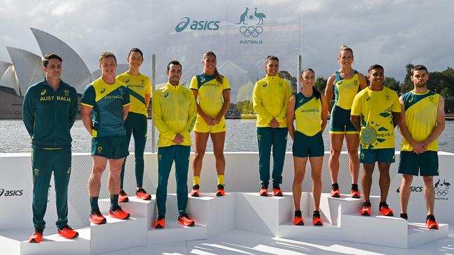 From L-R: Australian athletes AJ Roach, Henry Hutchinson, Marina Carrier, Jake Birtwhistle, Charlotte Caslick, Lisa Darmanin, Katie Ebzer, Lucy Stephan, Maurice Longbottom and Tom O'Halloran pose during the unveiling of the ASICS Australian Olympic Team competition uniforms for Tokyo. Source: AFP