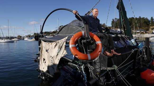 Samuel with the raft at Oyster Cove Marina after travelling down the Derwent River from Hobart.  Samuel McLennan who has built a raft entirely out of plastic waste found on Tasmania's coastline and waterways with the aim to sail to Sydney.  Picture: Nikki Davis-Jones