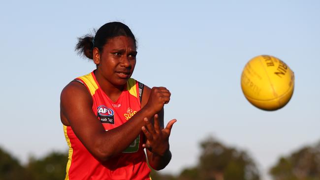 Kitara Whap-Farrar handballs during a Gold Coast Suns AFLW training session at Austworld Centre at Metricon Stadium on November 25, 2019 in Gold Coast, Australia. (Photo by Chris Hyde/Getty Images)