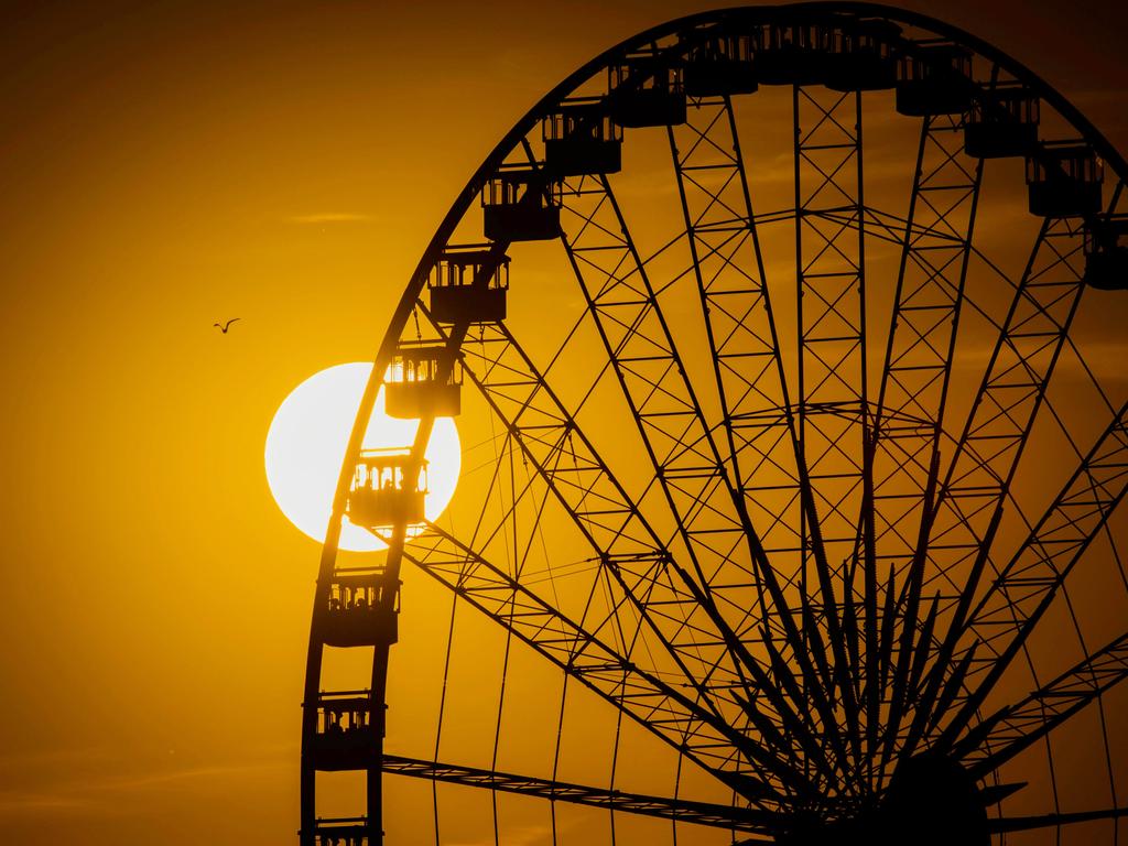 The Ferris wheel of the Rhein fun fair is pictured at sunset on July 16, 2018 in Duesseldorf, western Germany. / AFP PHOTO / dpa / Jana Bauch / Germany OUT