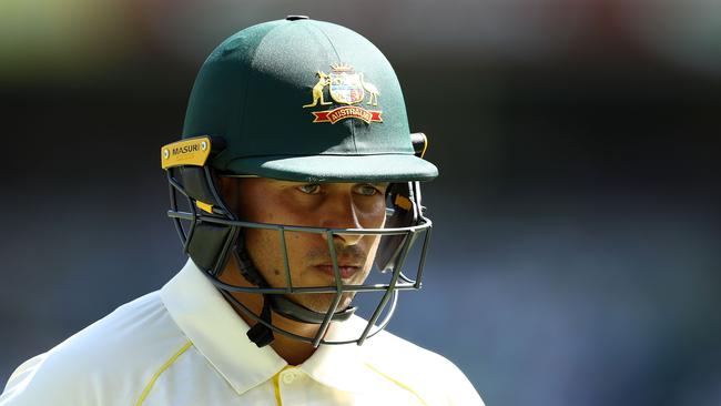 Usman Khawaja leaves the field after falling to off-spinner Moeen Ali.