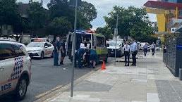 A man being taken in an ambulance following an incident on Lawson St, Southport. Picture: Lea Emery