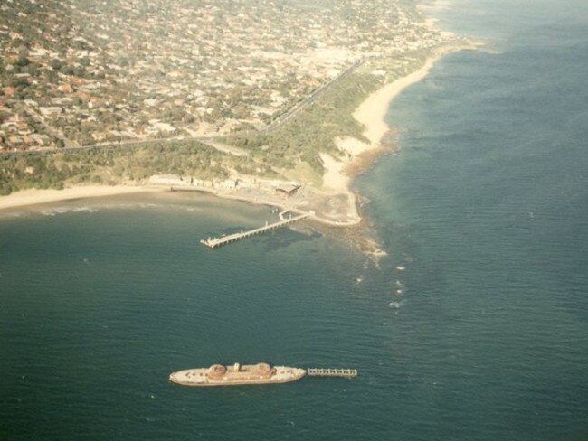 HMVS Cerberus pictured from the sky. The ship was sunk in Half Moon Bay in 1926 to act as a breakwater for the yacht club. Picture: HWt library.