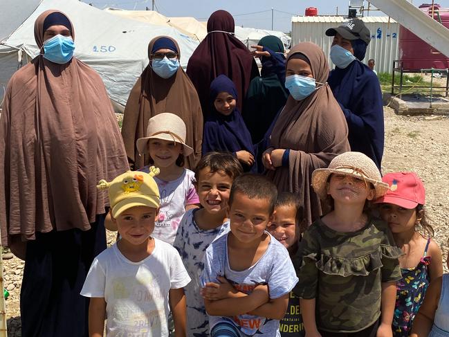 Australian women and children at al-Roj camp in northeastern Syria. The woman are (L-R) Mariam Dabboussy, Aminah Assaad, Nesrine Zahab (she has her back turned, tall one at the back), Shayma Assaad and Bessima Assaad (Bessima is in the black cap) Children are (L-R) Abdul Rahman (first left), son of Nesrine Zahab, Alaa & Umayr (third and fourth from left), sons of Shayma Assaad, and far right Mariam, daughter of Shayma Assaad.Picture: Ellen Whinnett / The Australian