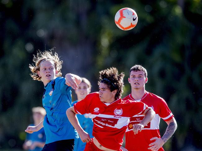 Palm Beach Currumbin State High's Kody Wright and Chancellor State College's  Matt Becker in action in the Queensland Schools Premier League Grand Finals match between Chancellor State College and  Palm Beach Currumbin State High School (red tops) at  Coplick Family Sports Park, Gold Coast. .  Picture: Jerad Williams