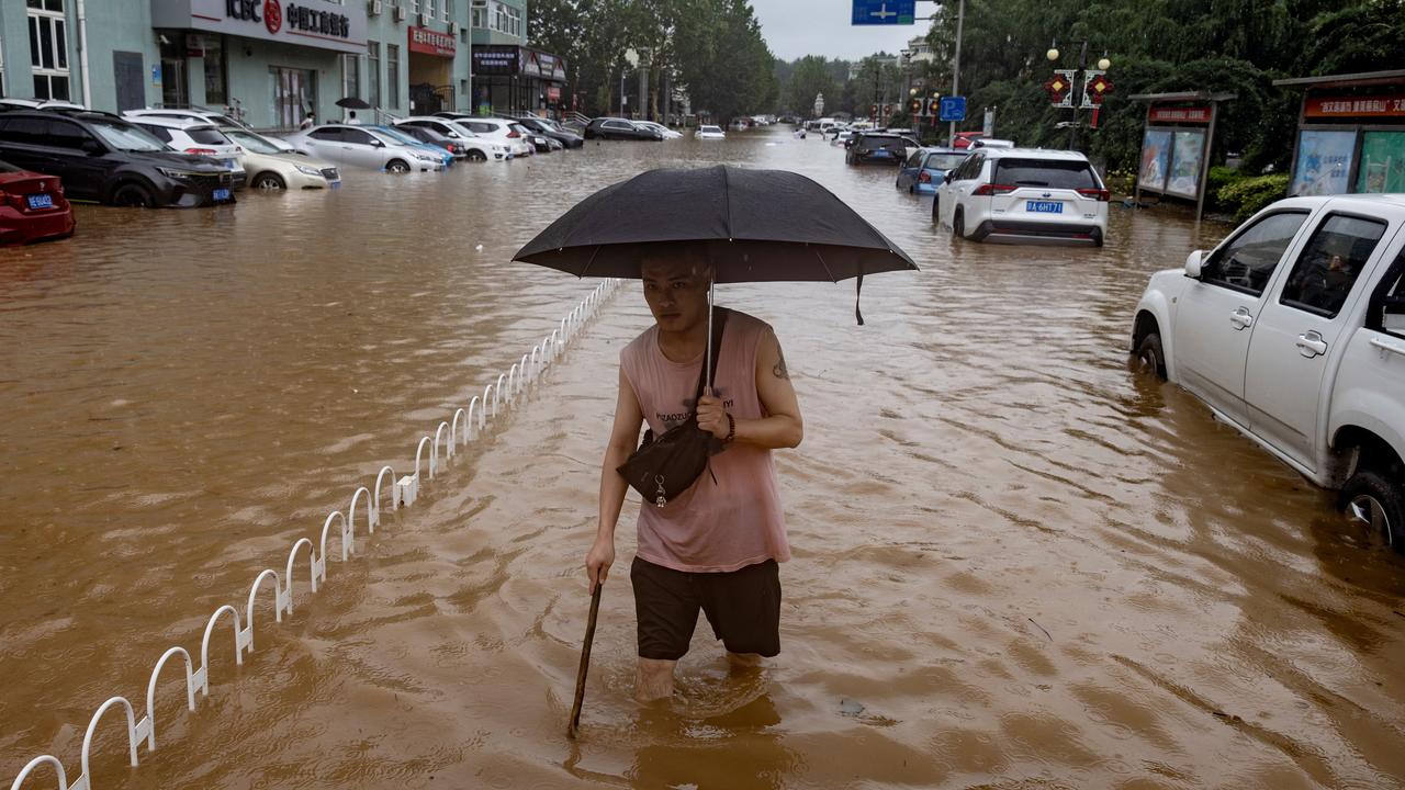 helicopters-drop-aid-to-flood-bound-beijing-commuters-the-australian