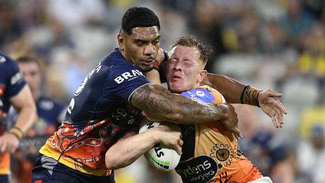 Alex Seyfarth of the Tigers is tackled by Thomas Mikaele of the Cowboys during the round 12 NRL match between North Queensland Cowboys and Wests Tigers at Qld Country Bank Stadium, on May 24, 2024, in Townsville, Australia. (Photo by Ian Hitchcock/Getty Images)