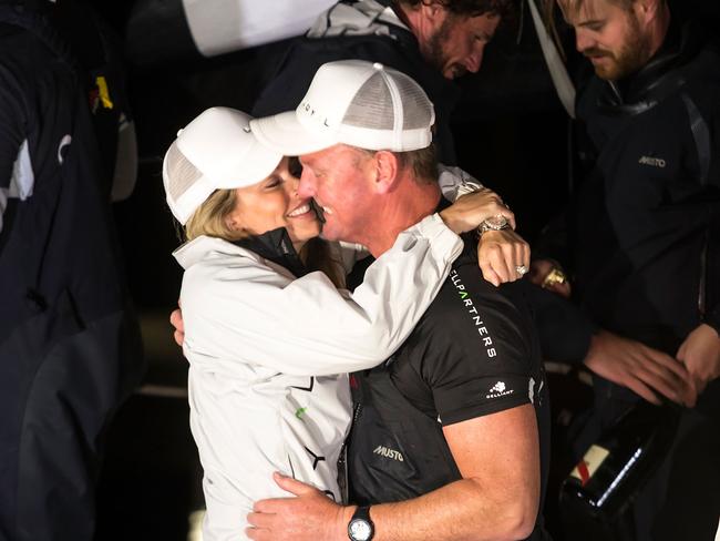 The couple embarce after after Bell skippered the winning 2016 Sydney To Hobart on December yacht Perpetual Loyal. Picture: Heath Holden/Getty Images