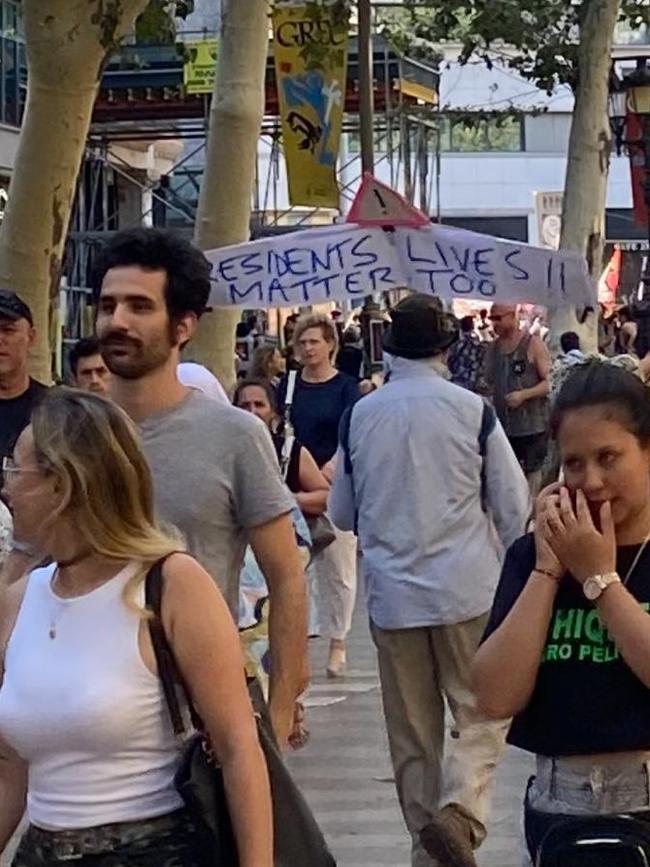 Anti-tourism sentiment in Barcelona including old bloke yelling about tourists and holding a banner, pointedly in English saying 'Residents lives matter too'. Picture: Rosie Wooley.