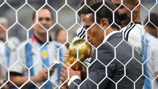 Nusret Goekce, nicknamed Salt Bae, kisses the FIFA World Cup Qatar 2022. Photo by Dan Mullan/Getty Images.