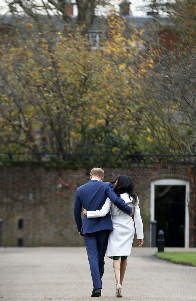 Walking away: Just over two years after announcing their engagement the couple said they will step down from senior royal duties. Picture: AP Photo/Alastair Grant, File.