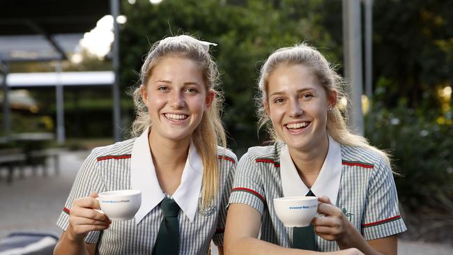 St Pauls year 12s Emma and Rachel Slade with coffees from their on-campus coffee shop. Picture: Josh Woning
