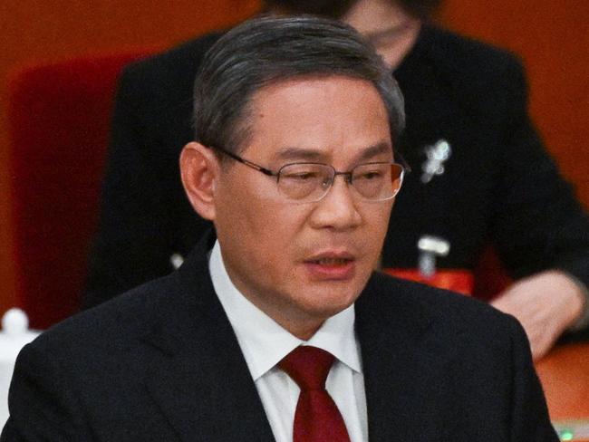 China's Premier Li Qiang speaks during the opening session of the National People's Congress (NPC) at the Great Hall of the People in Beijing on March 5, 2024. (Photo by Pedro Pardo / AFP)