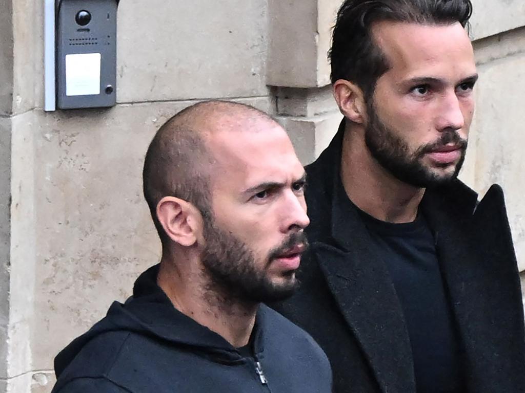 Andrew Tate (L) and his brother Tristan Tate (R) have been charged with human trafficking and rape. (Photo by Daniel MIHAILESCU / AFP)