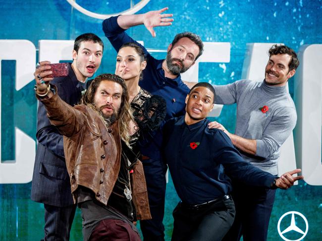 The Justice League cast goofing around. (From left) Miller, Momoa, Gadot, Ben Affleck, Fisher and Superman himself, Henry Henry Cavill. Picture: AFP PHOTO / Tolga Akmen