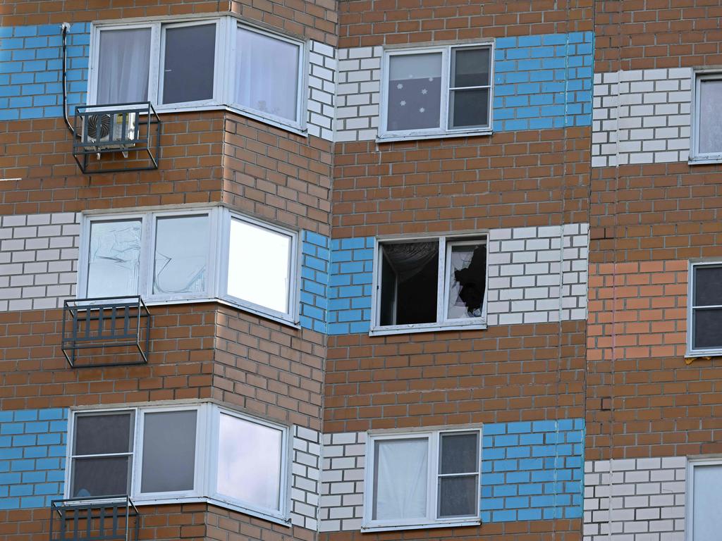 A view shows a broken window in a multistorey apartment building after the reported drone attack.