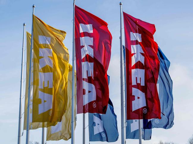 A photo taken on December 18, 2017 shows flags flying outside a store of Swedish furniture giant Ikea in Delft, the Netherlands. The EU on December 18 opened an in-depth investigation into the complex tax deals tying Swedish furniture giant Ikea with the Netherlands in the latest salvo by Brussels against the tax affairs of multinationals. / AFP PHOTO / ANP / Robin Utrecht / Netherlands OUT