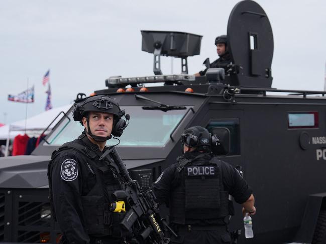 Police stand guard before a campaign rally by former US President and Republican presidential candidate Donald Trump in Uniondale, New York, on September 18, 2024. (Photo by DAVID DEE DELGADO / AFP)